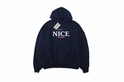Balenciaga 'be Nice' Hoodie - Blue Unisex Streetwear Limited Edition - This Balenciaga hoodie features a playful 'Be Nice' slogan with 'France' crossed out beneath it.