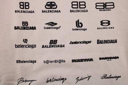 Balenciaga Multilogo Hoodie - Beige Unisex Streetwear Limited Edition - This Balenciaga hoodie showcases an array of the brand's logos in a distinctive pattern on