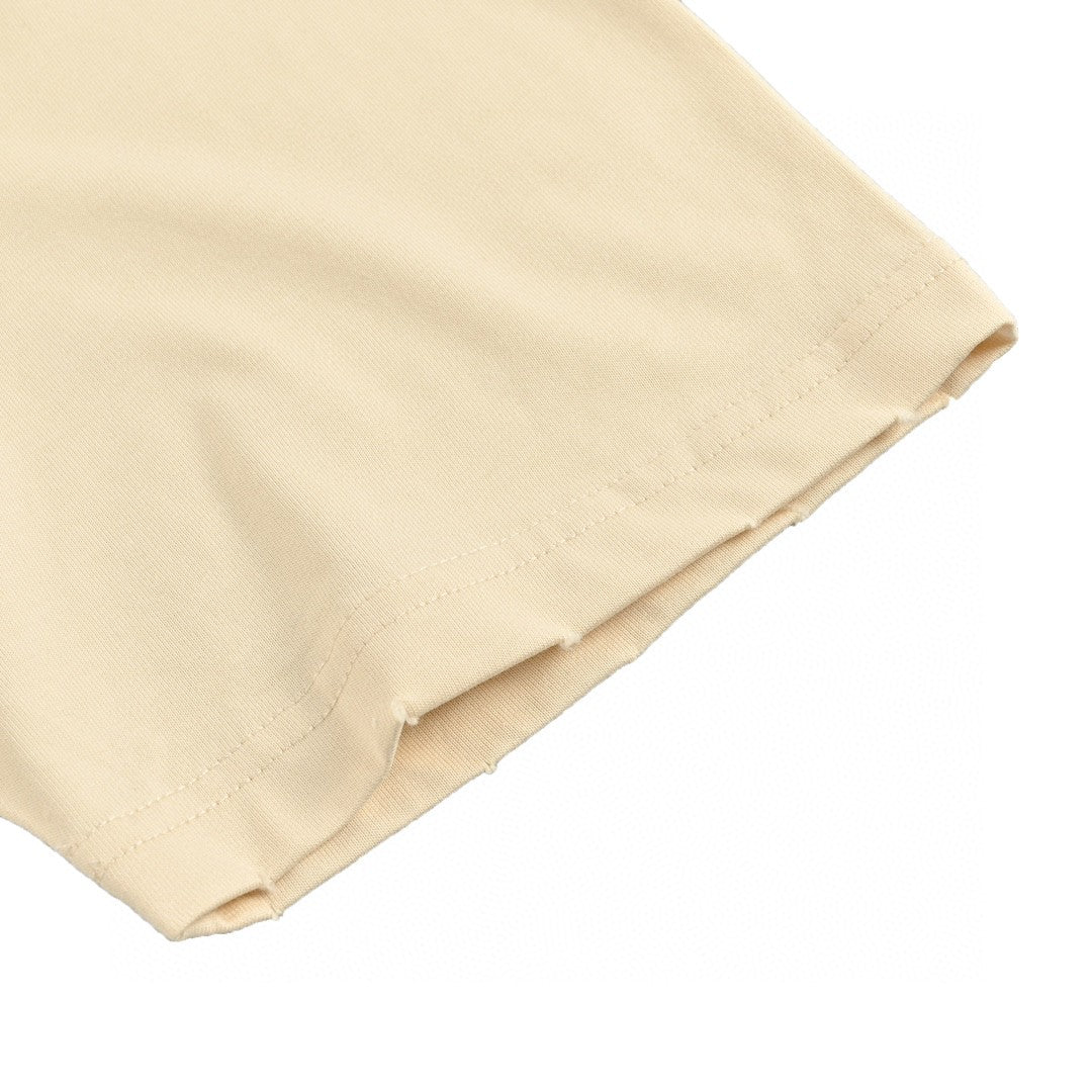 Camiseta Balenciaga beige con notas musicales