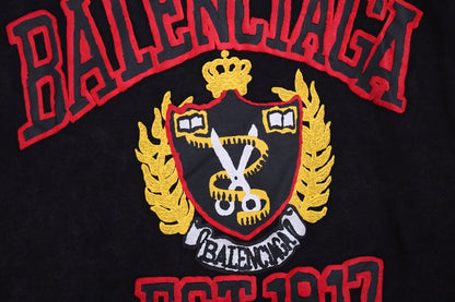 Balenciaga Crest Hoodie - Black Unisex Streetwear Limited Edition - This Balenciaga hoodie features a prominent crest design in red and gold, highlighting the brand's