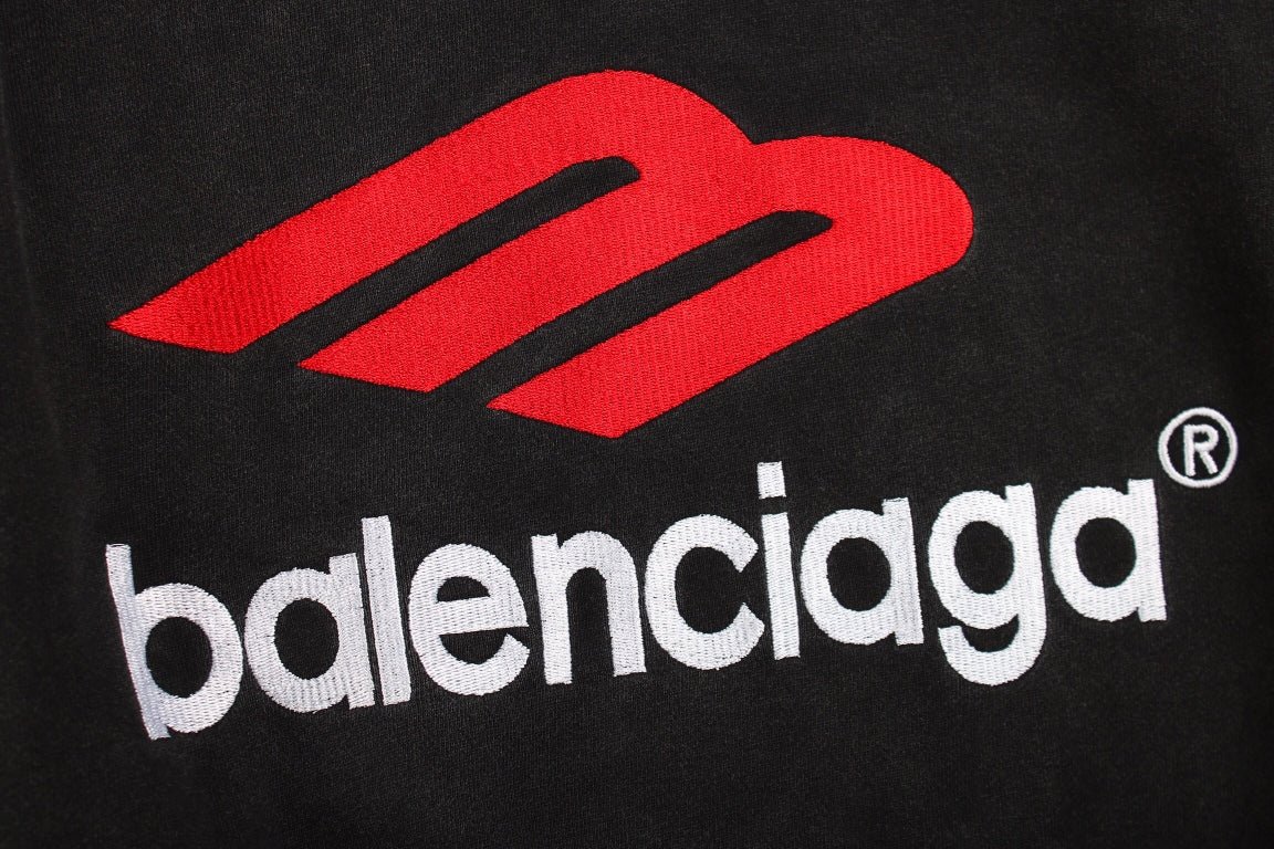 Balenciaga Hoodie - Black Unisex Streetwear Limited Edition - This Balenciaga hoodie features a striking red and white logo on the front. Made from