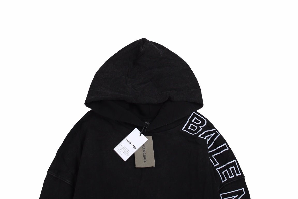 Balenciaga Oversized Hoodie - Black Unisex Streetwear Limited Edition - This Balenciaga hoodie features an oversized fit with a minimalist yet striking design. The black