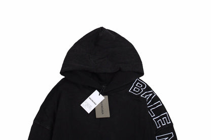 Balenciaga Oversized Hoodie - Black Unisex Streetwear Limited Edition - This Balenciaga hoodie features an oversized fit with a minimalist yet striking design. The black