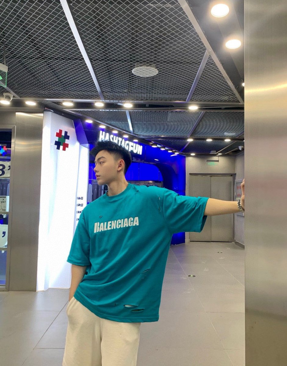 Balenciaga Distressed Logo T-shirt Unisex Streetwear Limited Edition - <span>This Balenciaga t-shirt features a vibrant turquoise design with intentional distressed details, giving it a