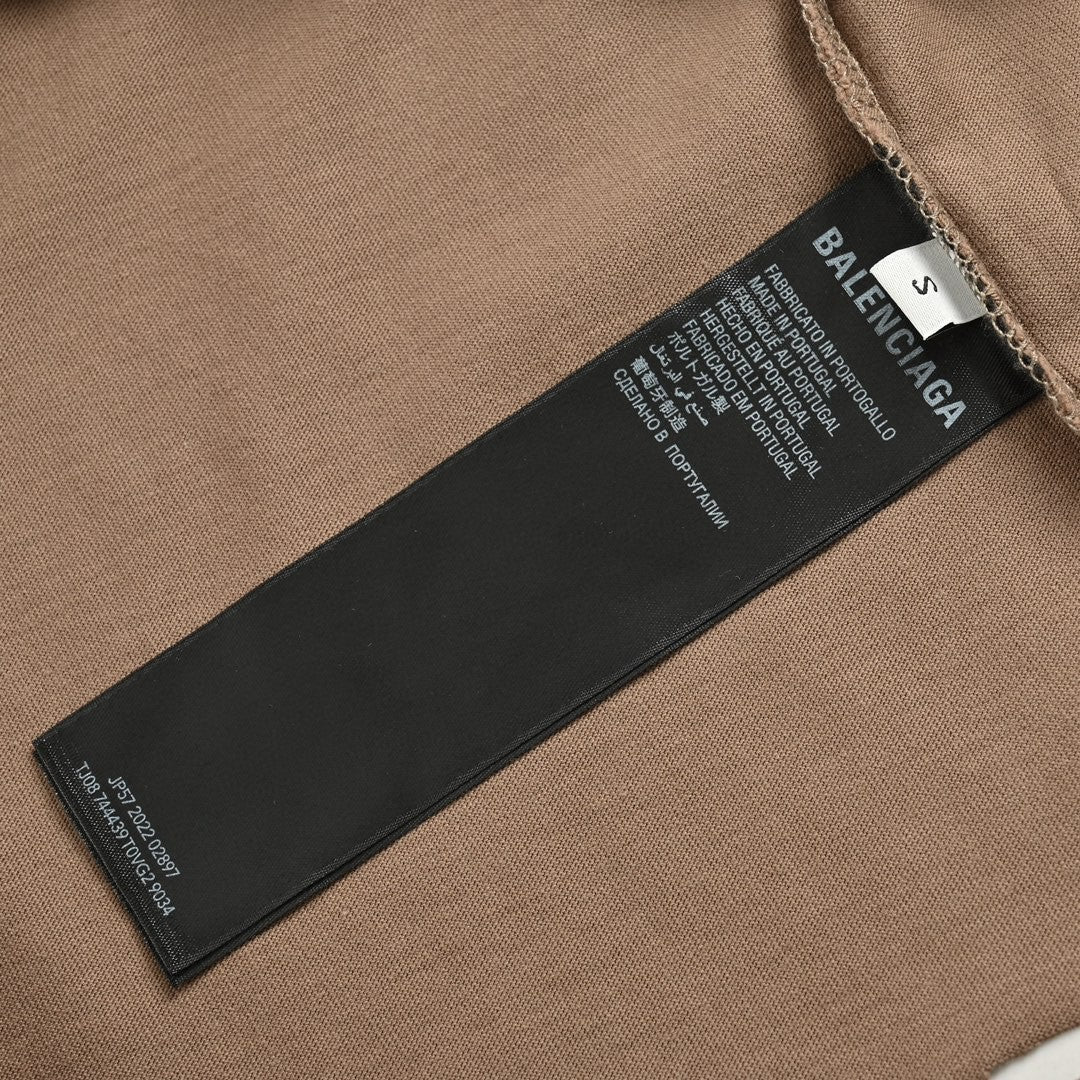 Balenciaga Distressed Logo T-shirt Unisex Streetwear Limited Edition - <span>This Balenciaga t-shirt features a muted taupe design with intentional distressed details, providing a trendy,