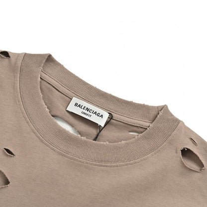 Balenciaga Distressed Logo T-shirt - Beige Unisex Streetwear Limited Edition - <span>This Balenciaga t-shirt features a muted beige design with intentional distressed details, providing a trendy,