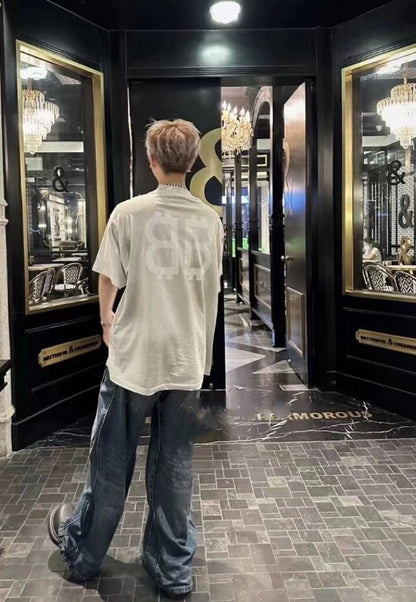 Camiseta Balenciaga con logo desgastado, blanca y gris