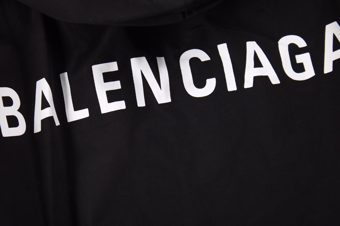 Balenciaga Jacket - Black Unisex Streetwear Limited Edition - Black jacket with hood. Front button closure and side zip pockets. Lightweight and perfect for