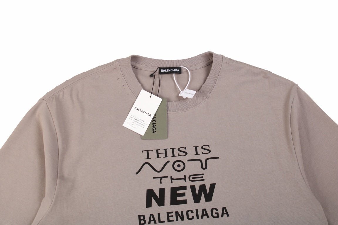 Balenciaga 'this Is Not The New Logo' T-shirt - Red Unisex Streetwear Limited Edition - This unique taupe-colored Balenciaga t-shirt carries a self-aware message, 'This is Not the New Balenciaga