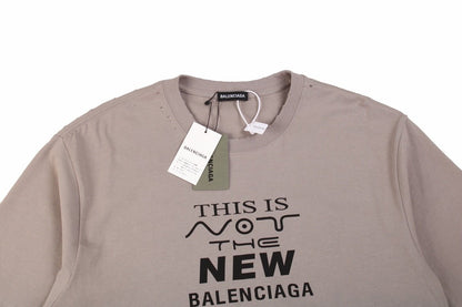 Balenciaga 'this Is Not The New Logo' T-shirt - Red Unisex Streetwear Limited Edition - This unique taupe-colored Balenciaga t-shirt carries a self-aware message, 'This is Not the New Balenciaga