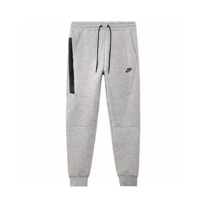 NIKE Tech Fleece Pants - Grey - - White Unisex Streetwear Limited Edition - The NIKE TECH FLEECE PANTS GREY/WHITE - REPLICA deliver the perfect combination of modern athletic