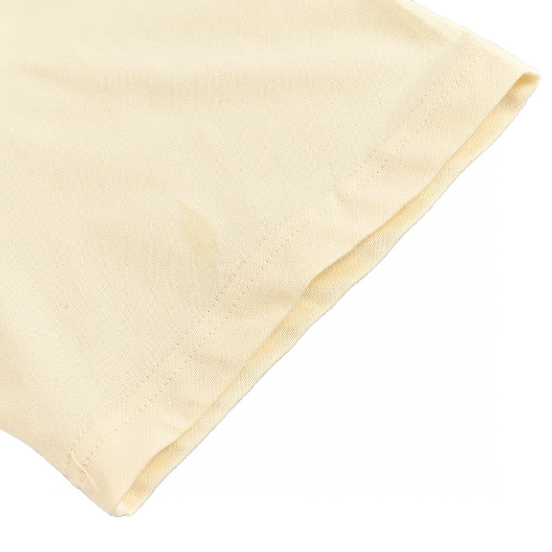 Camiseta Dior color crema con ribete negro