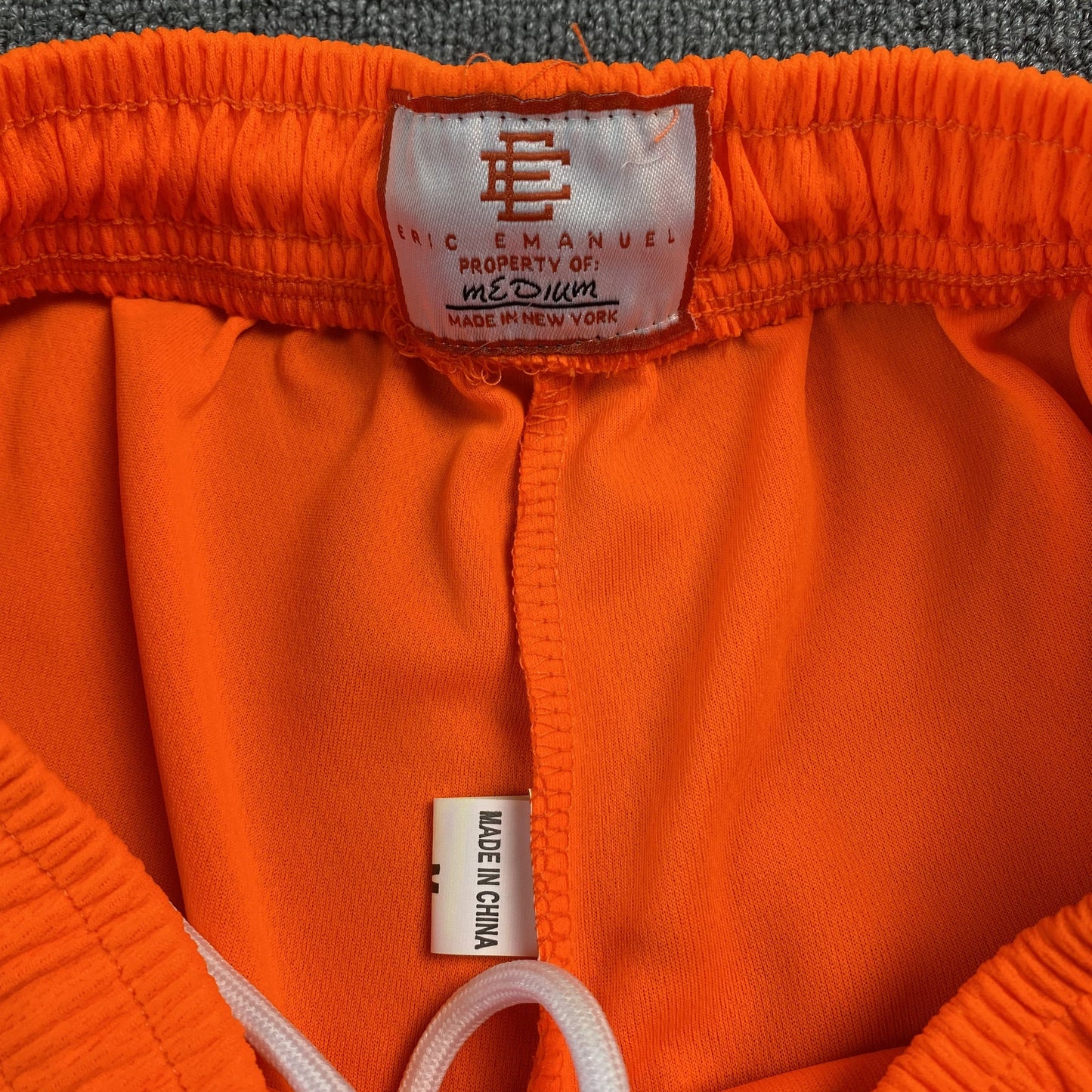 ERIC Emanuel Ee Basic Shorts Orange - - Blue Unisex Streetwear Limited Edition - The ERIC EMMANUEL EE BASIC SHORTS ORANGE/BLUE - REPLICA combine vibrant streetwear aesthetics with premium