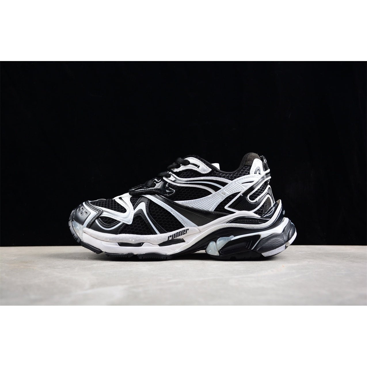 BALENCIAGA Runner - White Sneakers - Black Unisex Streetwear Limited Edition - The BALENCIAGA Runner x Black White sneakers exude a sleek and timeless elegance, perfect for