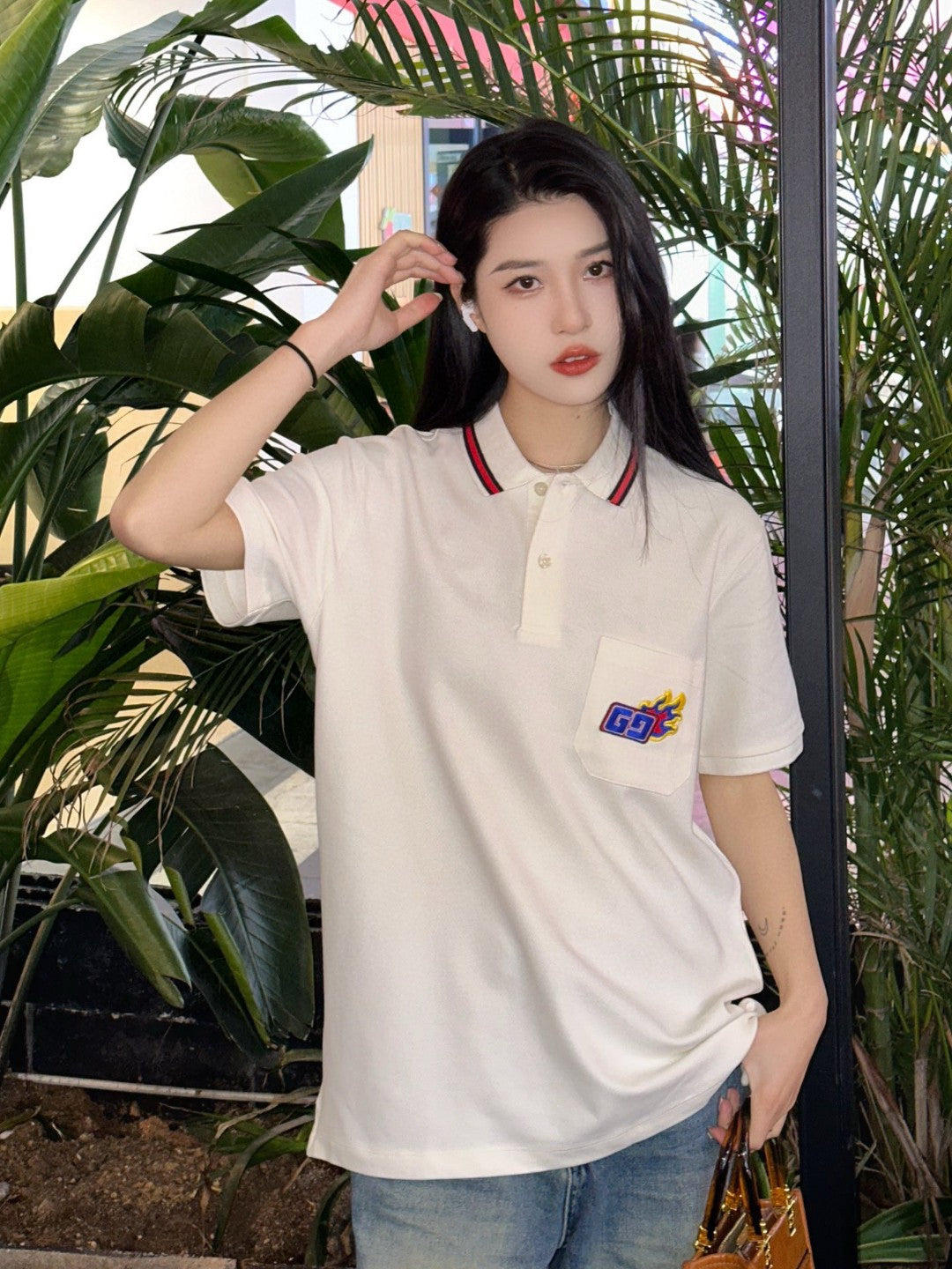 Gucci Flame Logo Polo Shirt - Black Unisex Streetwear Limited Edition - <span>This Gucci polo shirt features a stylish cream color with unique design elements. It includes