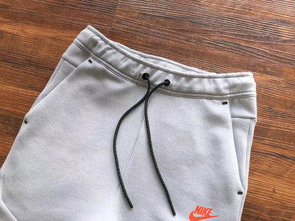 NIKE Tech Fleece Pants - Wolf Grey - Aquamarine - - Orange Unisex Streetwear Limited Edition - The NIKE TECH FLEECE PANTS WOLF GREY/AQUAMARINE/ORANGE - REPLICA offer a modern fusion of performance,