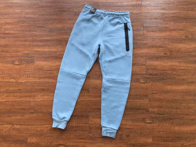 NIKE Tech Fleece Pants - Light - Blue Unisex Streetwear Limited Edition - The NIKE TECH FLEECE PANTS LIGHT BLUE - REPLICA blend modern athletic performance with sleek